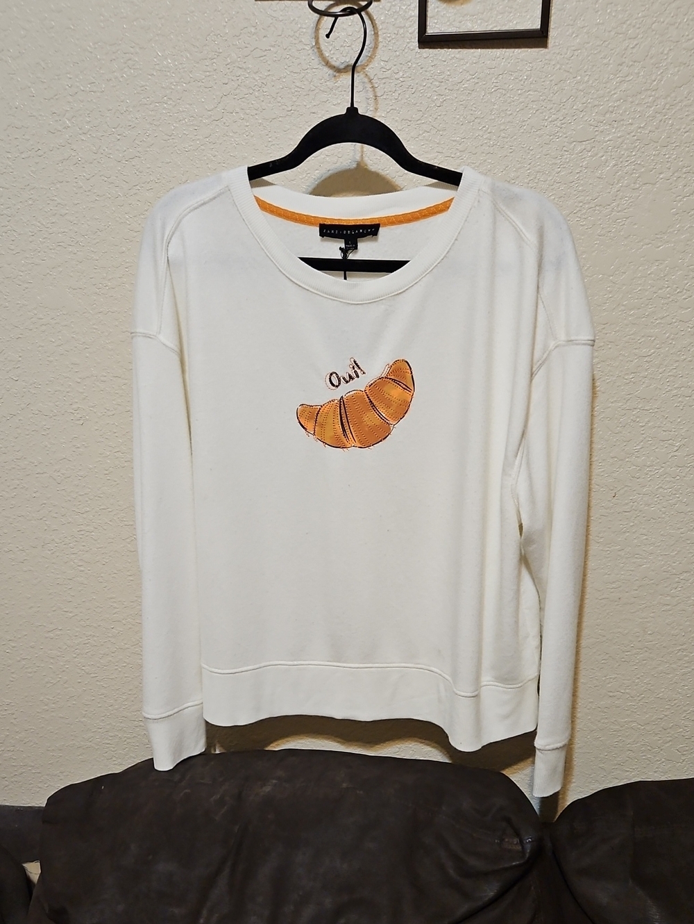 Jane and Delancey Cream Crewneck Sweatshirt with Orange Croissant Motif